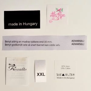 Nyomott bevarrható ruhacímke